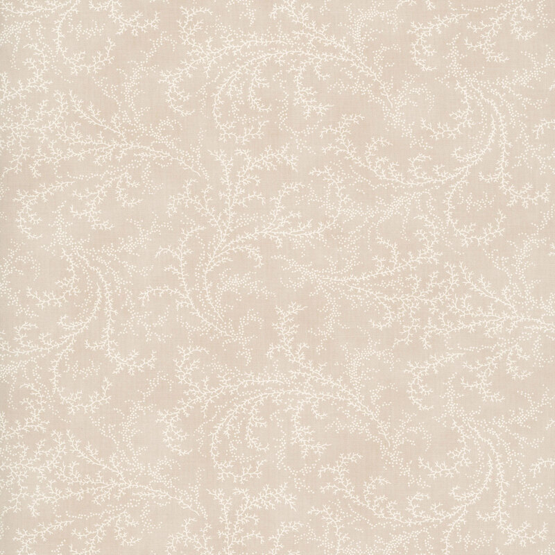 Tan fabric with a tonal pattern of swirling vines and dots.