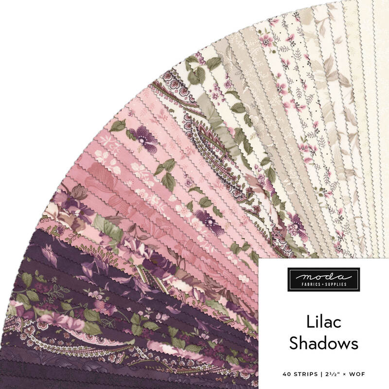 Fabric sample fan in pink, purple, and cream floral patterns labeled “Lilac Shadows.”