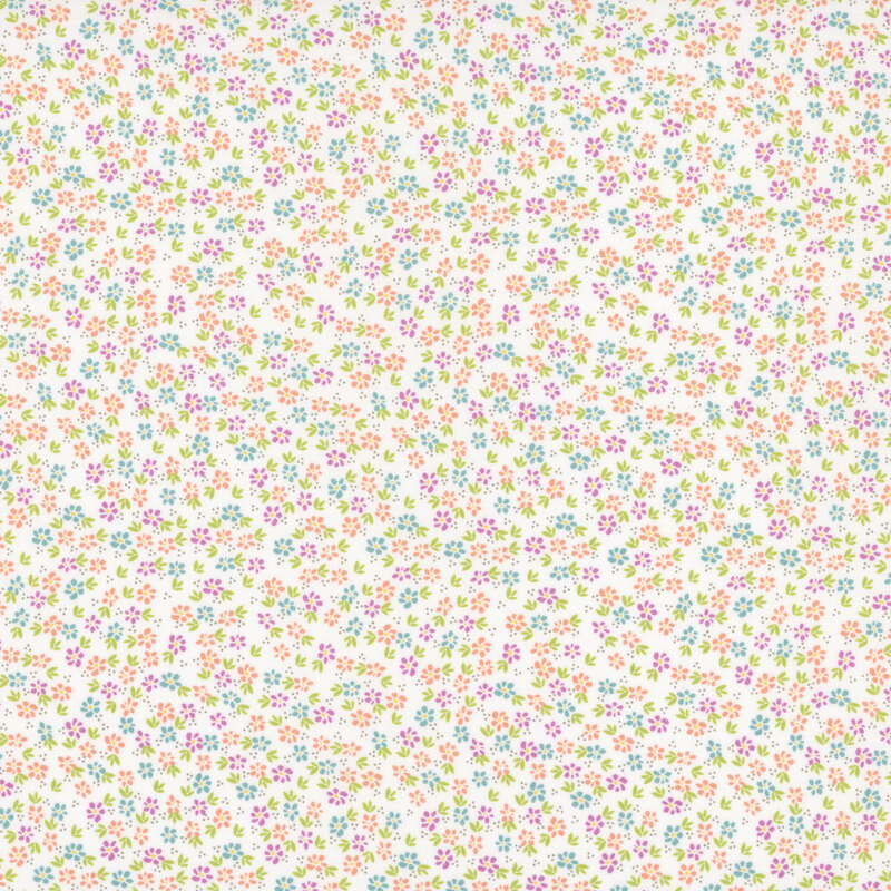 A white fabric with packed colorful flowers and green leafy sprigs.