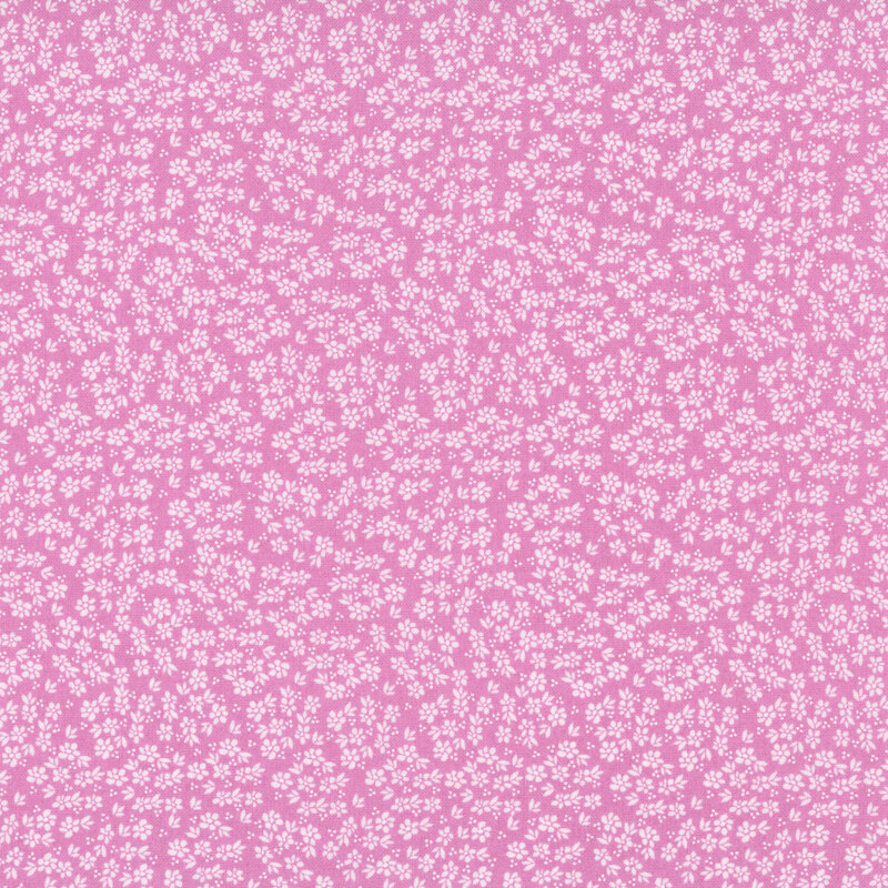 A pink fabric with light pink flowers.