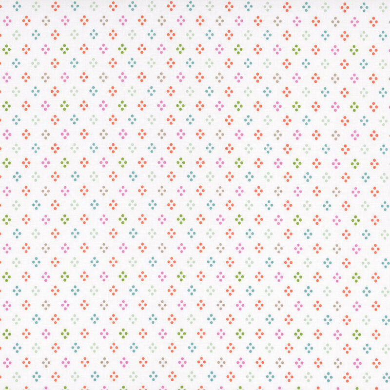 A white fabric with rows of colorful four dot diamonds.