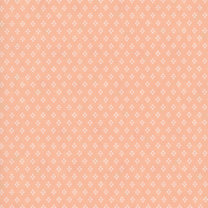 A peach fabric with neat rows of pour-dot diamonds.
