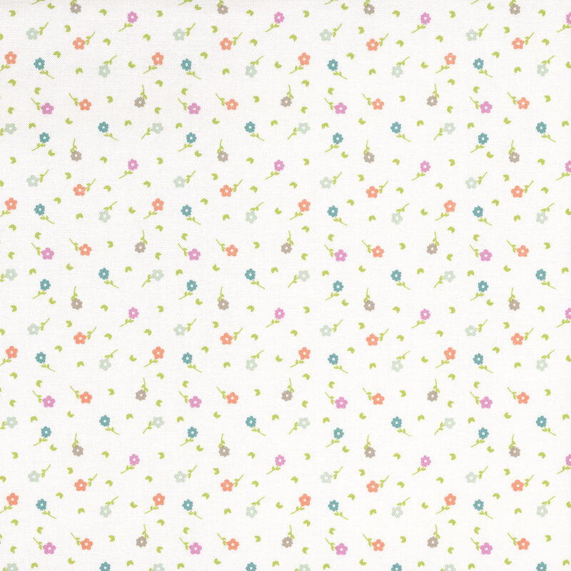 A white fabric with scattered flowers and green leaves.