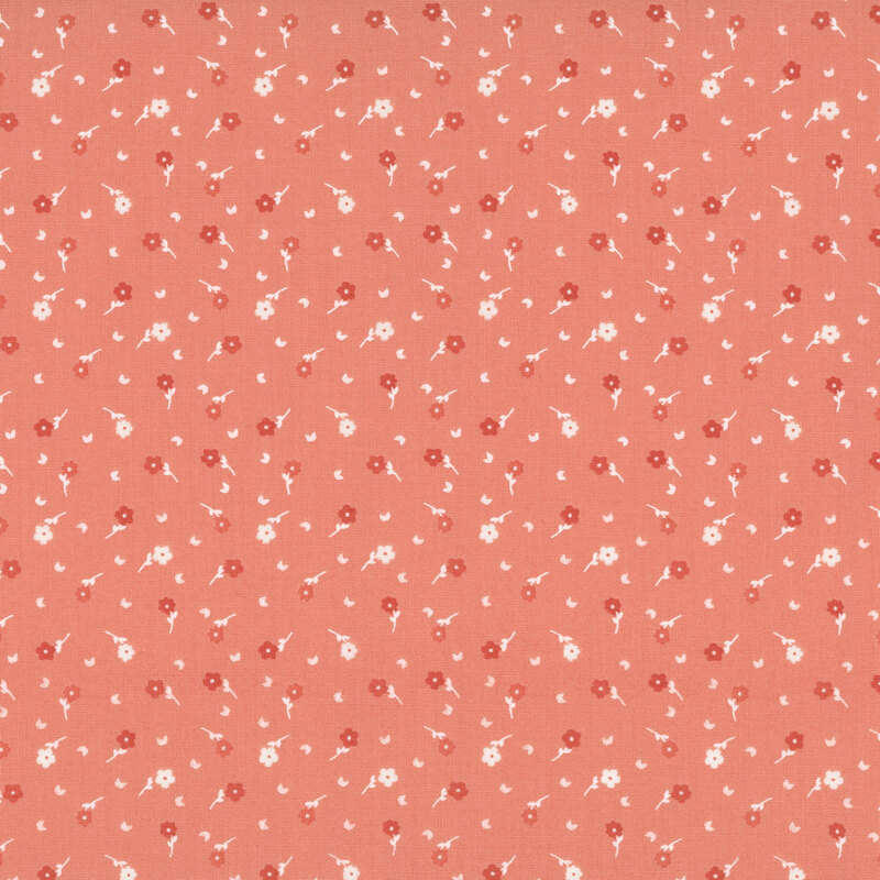 A light salmon fabric with scattered flowers and white leaves.