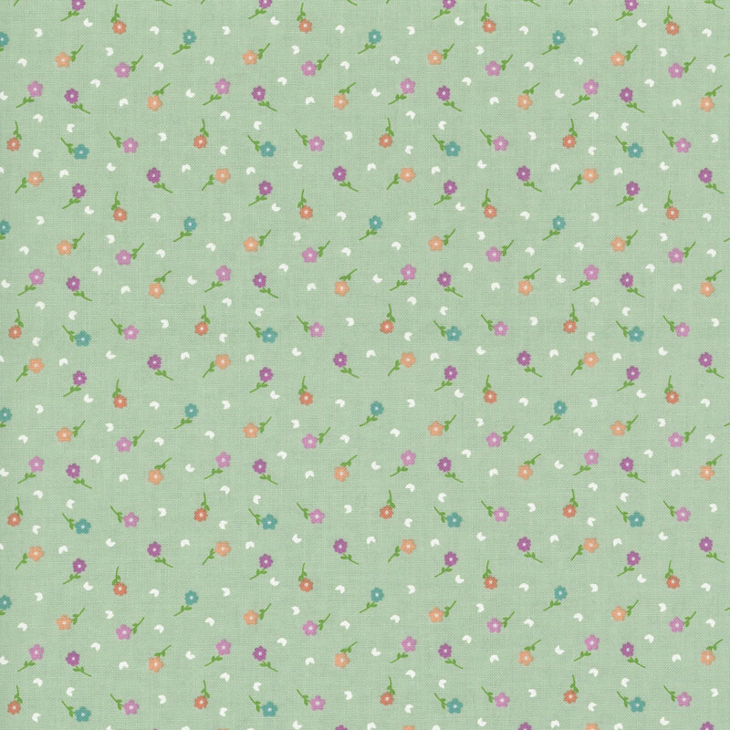 A mint green fabric with scattered flowers and white leaves.