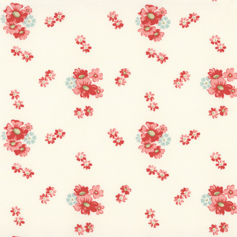 clusters of red and pale blue floral blossoms scattered on an ivory background.