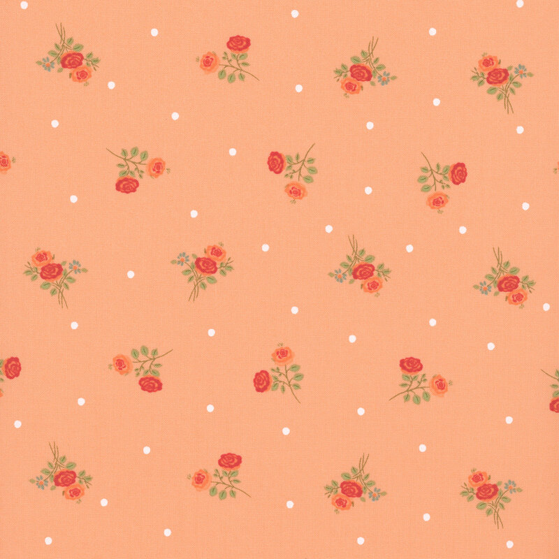 peach fabric with scattered red and coral rose sprigs accented by white dots.