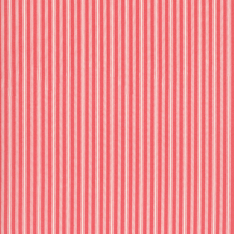 coral red fabric featuring slender cream vertical stripes in varying widths.