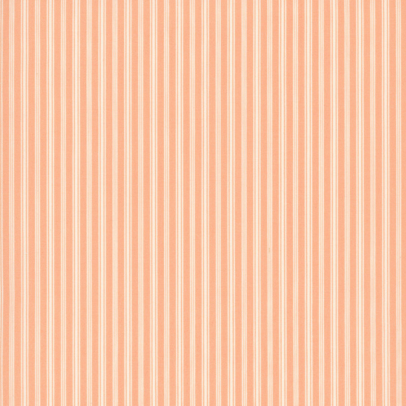 peach fabric featuring slender cream vertical stripes in varying widths.