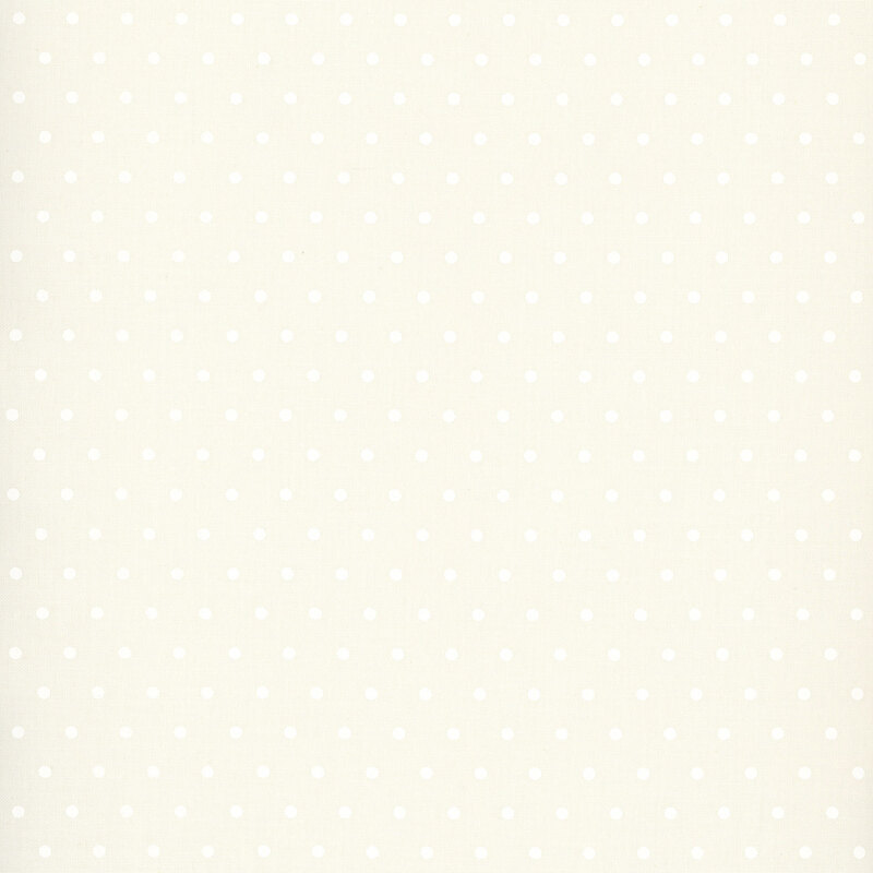 white polka dots on a soft ivory background.