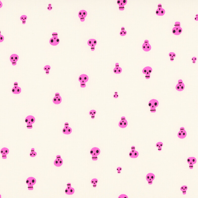 A cream fabric with scattered highlighter pink skulls.