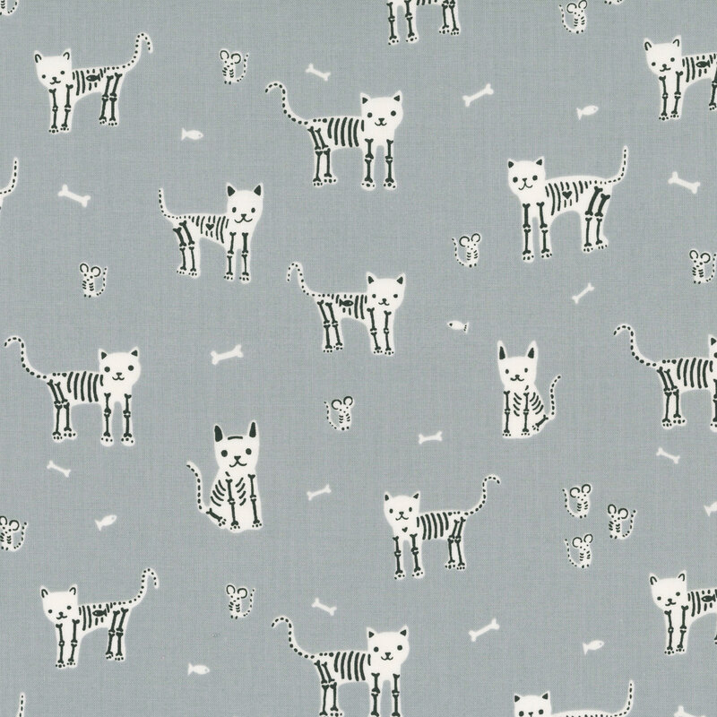 A light gray fabric with scattered skeleton cats, mice, and fish.