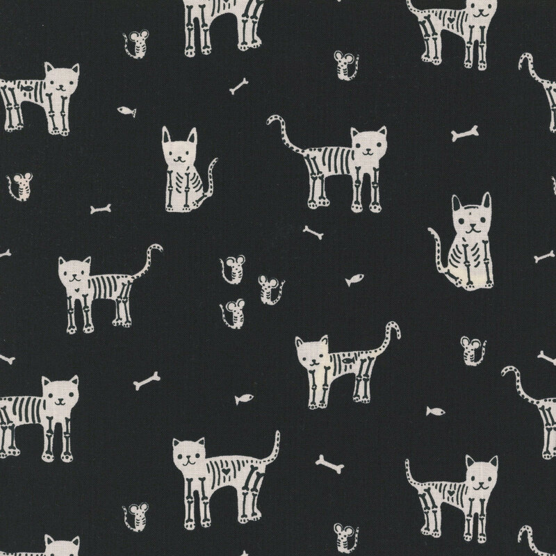 A black fabric with scattered skeleton cats, mice, and fish with bones.