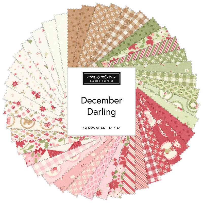Fabric swatch fan of “December Darling” quilt squares in red, green, and cream.