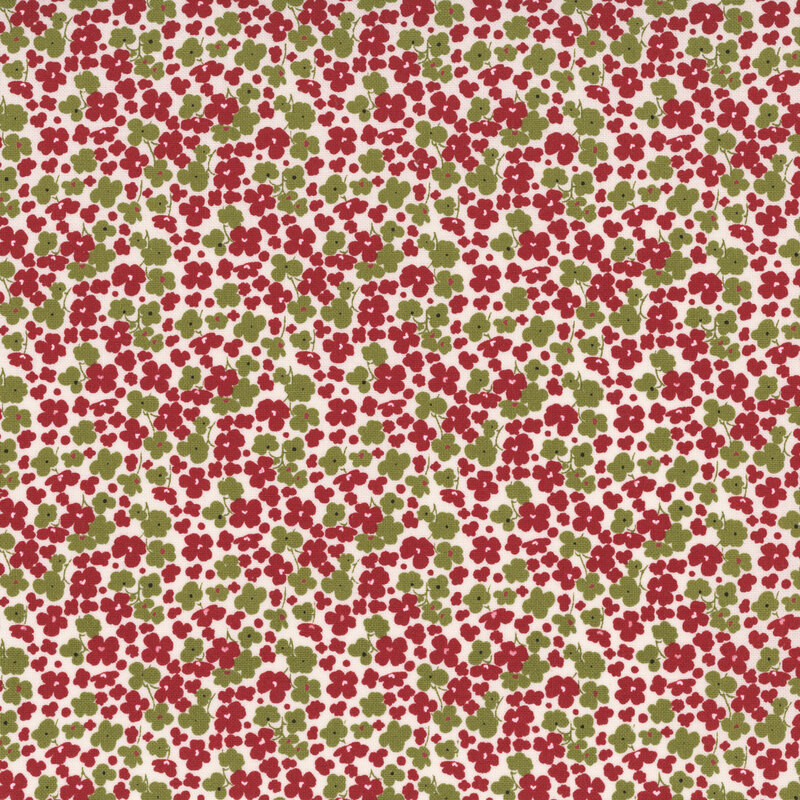 White fabric with a dense pattern of red and green florals.