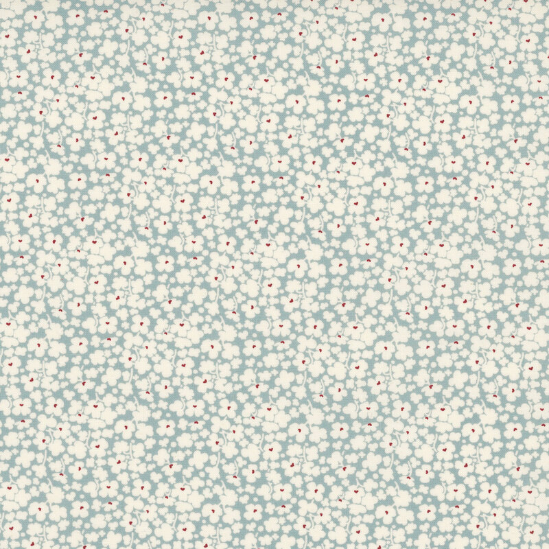 Soft blue fabric with a dense pattern of white florals.