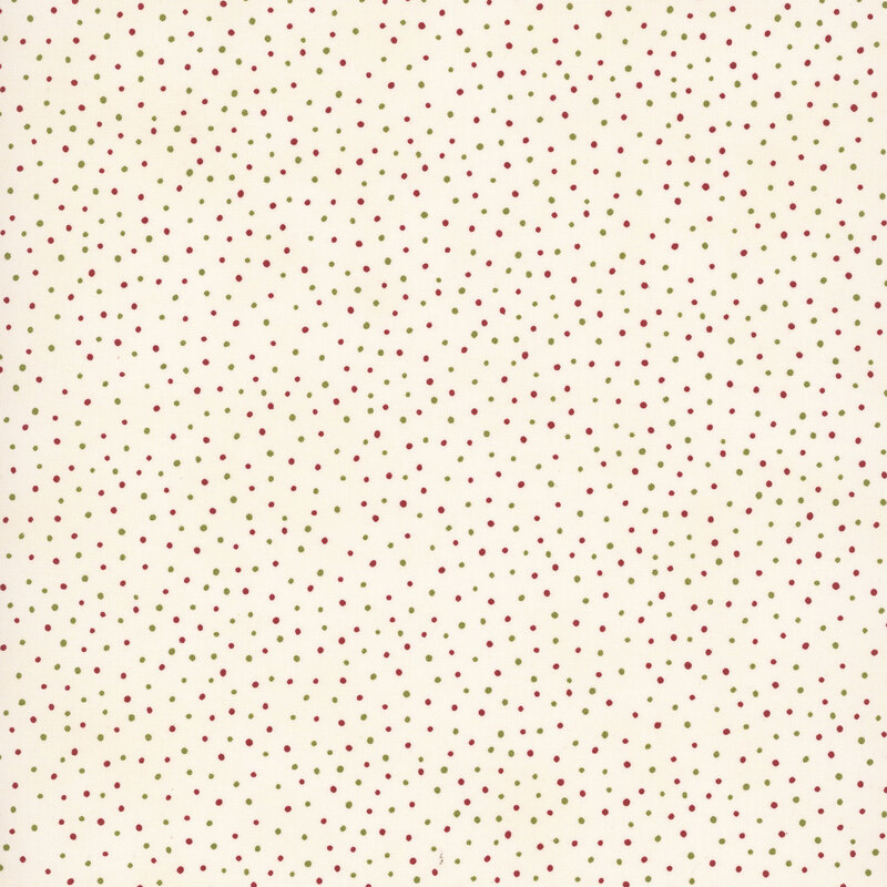 Cream fabric with a pattern of scattered red and green dots. 
