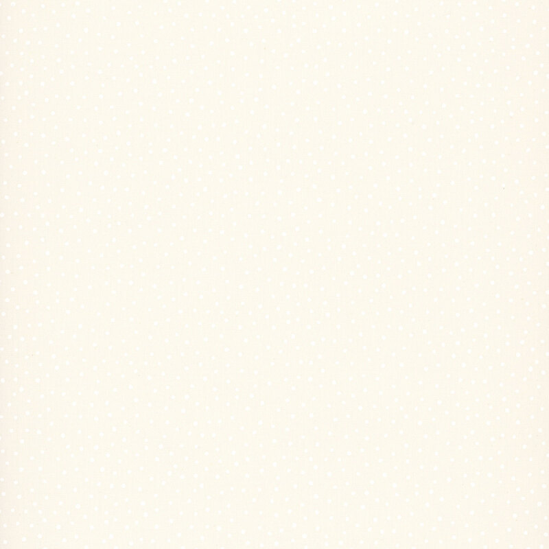 Off white fabric with a tonal pattern of scattered dots. 