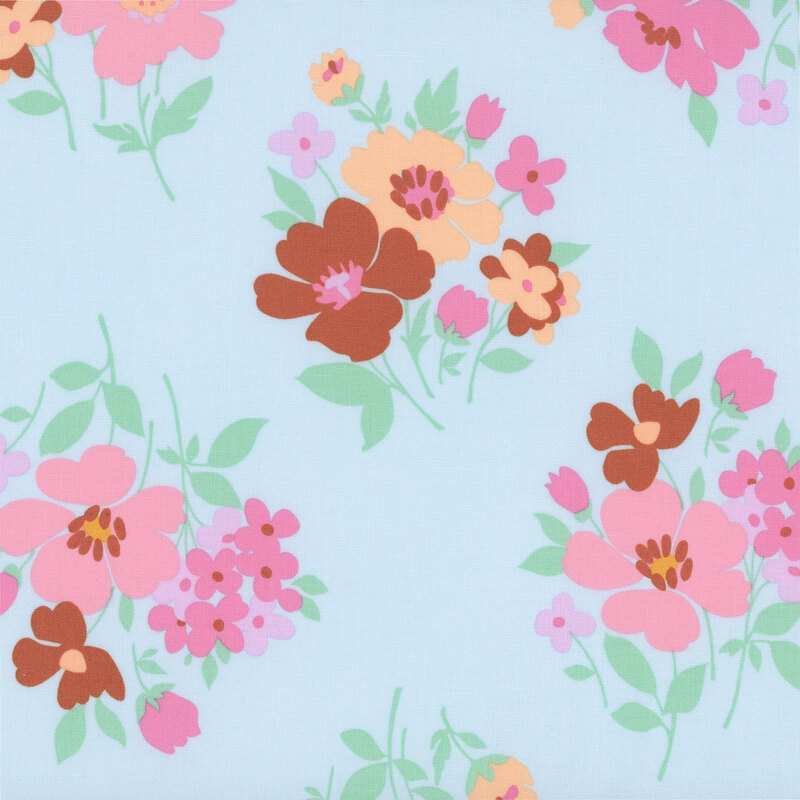 Sky blue fabric with a scattered design of novel floral bunches.
