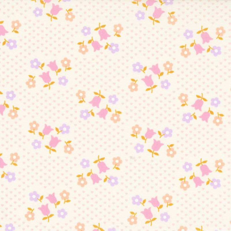 Cream fabric with a scattered design of small pink hearts and groups of pastel florals.