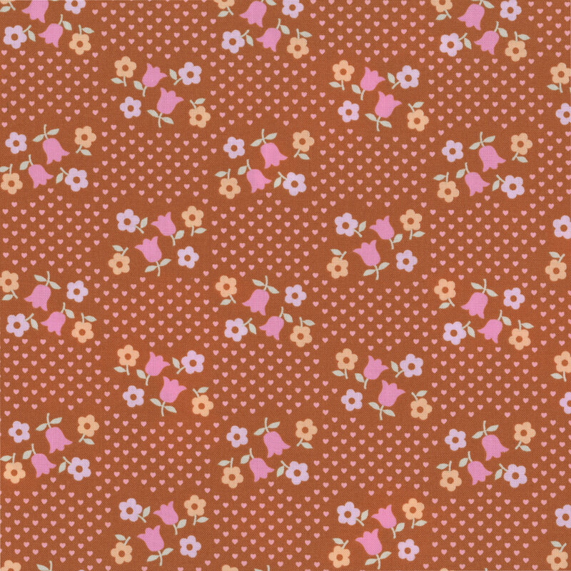 Burnt sienna fabric with a scattered design of small pink hearts and groups of pastel florals.
