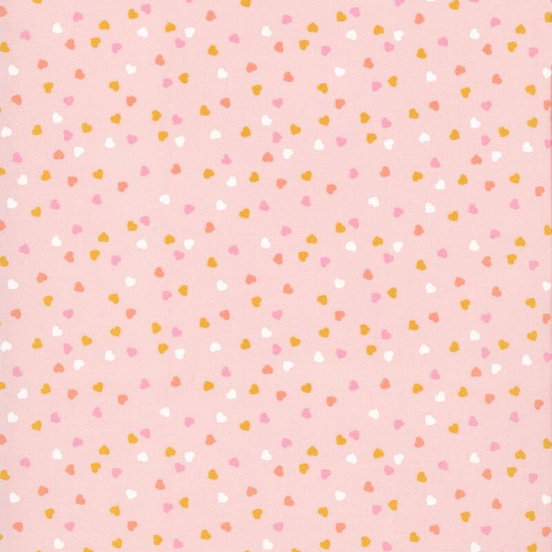 Pastel pink fabric with a playful tossed pattern of small, multicolored hearts.