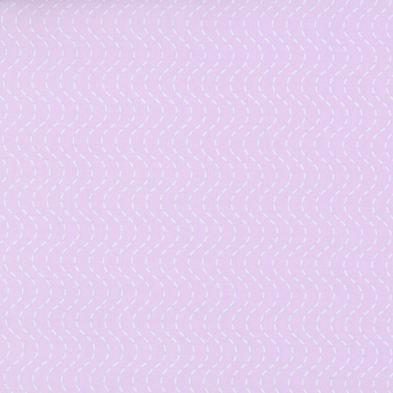 Periwinkle fabric with a baby blue wavy, dashed-stripe design.