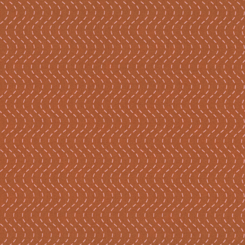 Burnt sienna fabric with a pink wavy, dashed-stripe design.