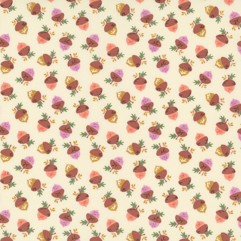 tossed acorns in gold, peach, and soft lilac hues, accented with tiny golden and green leaves on a warm cream background.