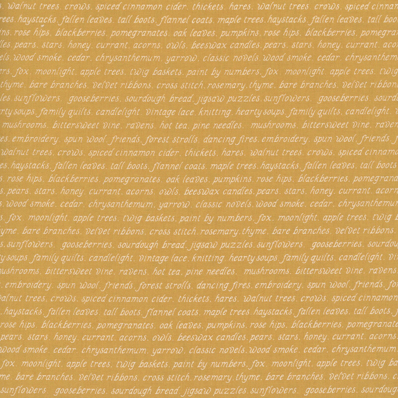 golden fabric with repeating rows of cream fall-themed words.