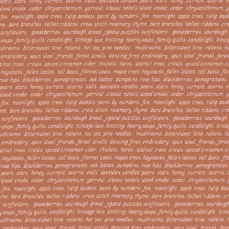 rust fabric with repeating rows of cream fall-themed words.