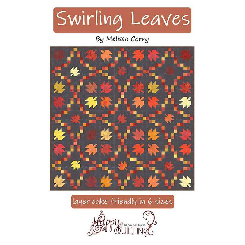 front cover of the Swirling Leaves quilt pattern cover featuring the finished leaf quilt quilt.