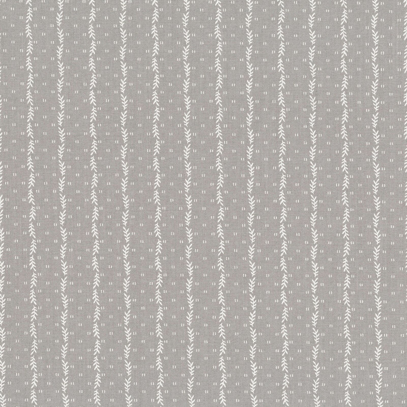 Smoke gray fabric with a striped pattern of small white leaves decorated with small, scattered primitive markings.