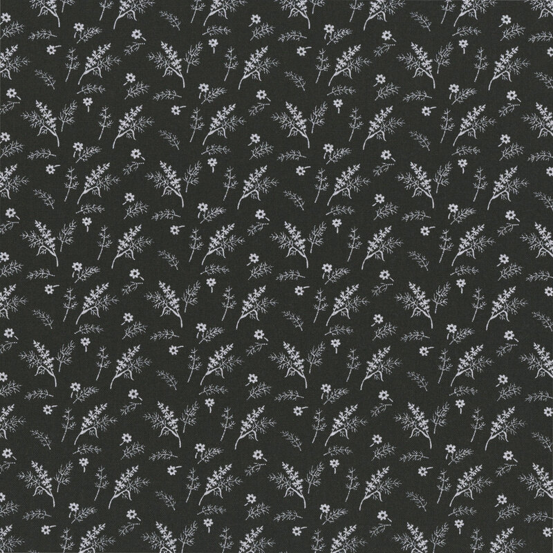 Charcoal-colored fabric with a tossed pattern of small white florals and leafy plant sprigs.