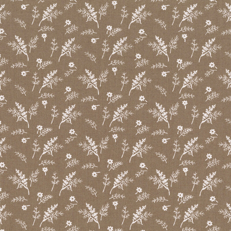 Taupe-colored fabric with a tossed pattern of small white florals and leafy plant sprigs.
