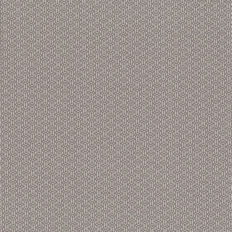 Smoke gray fabric with a packed, geometric design of arrow motifs and diamond shapes.