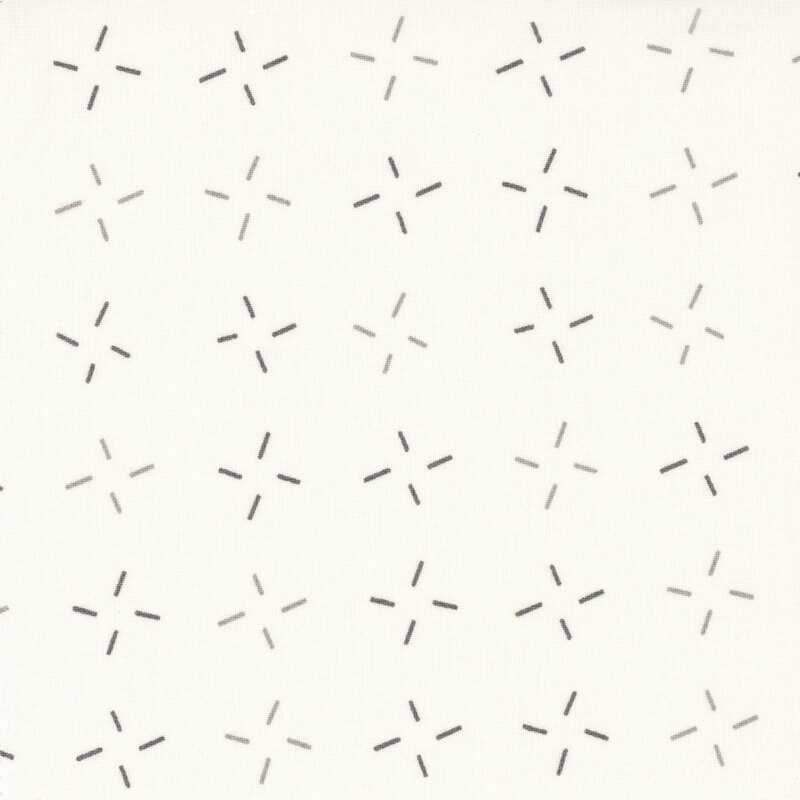Cream fabric with an abstract design of smoke gray and ash gray dashes grouped together.