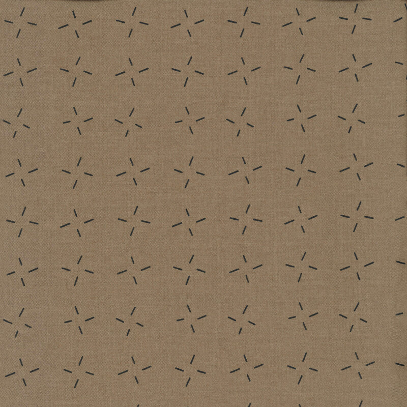 Taupe fabric with an abstract design of black dashes grouped together.