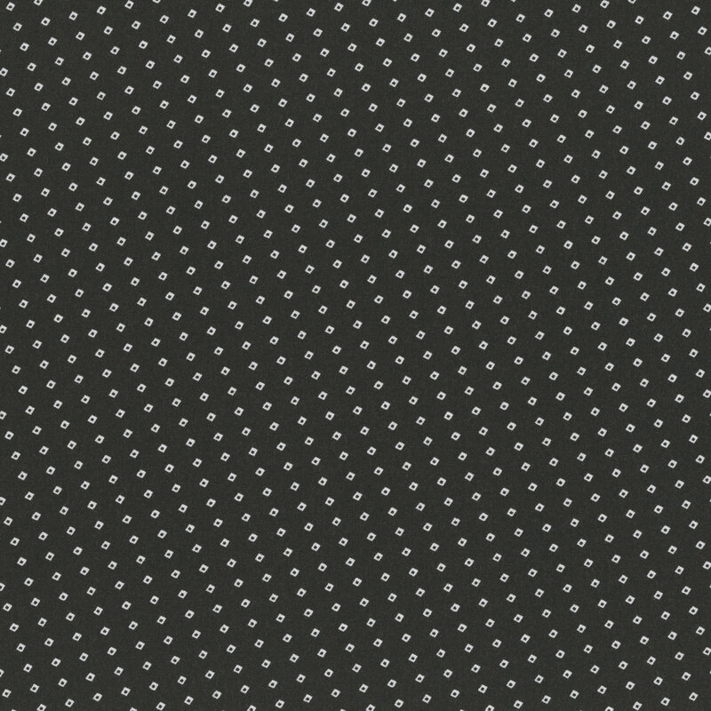 Charcoal colored fabric with a biased grid design of small white squares.
