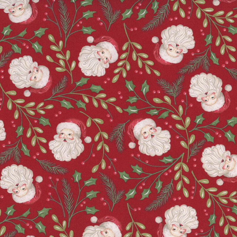 Red fabric with a tossed pattern of rosy-cheeked Santas surrounded by pine, winterberry, and holly sprigs. 