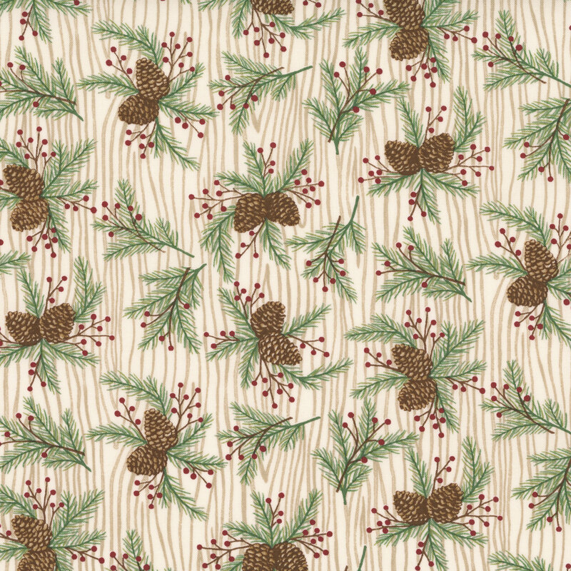 Cream fabric with a natural wood grain pattern topped with tossed pine boughs.