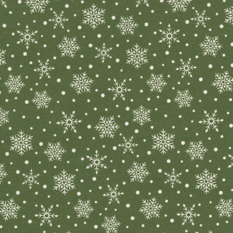 Green fabric with a scattered pattern of white snowflakes and dots.