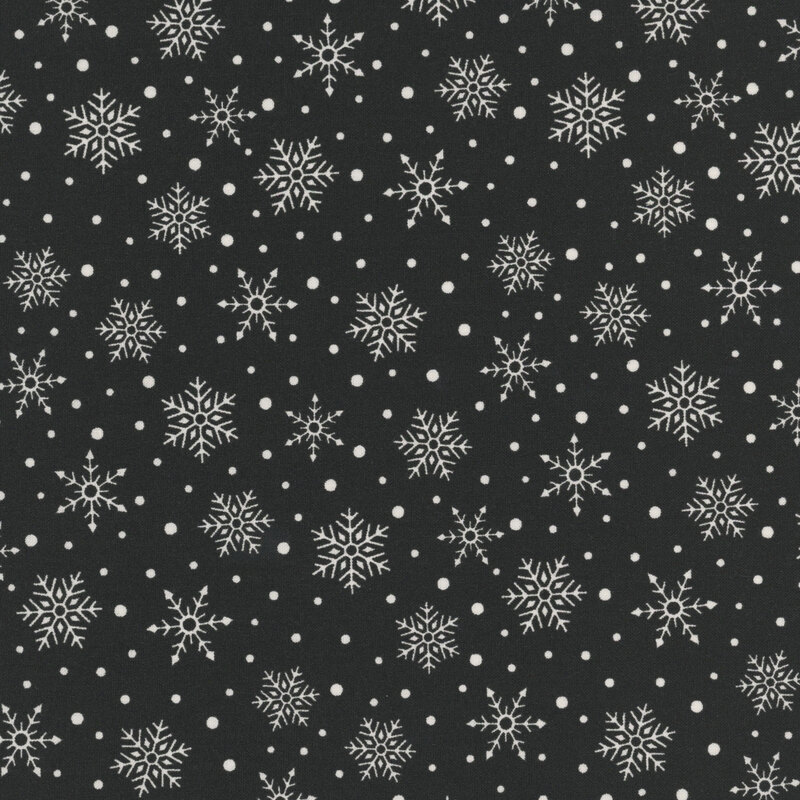Black fabric with a scattered pattern of white snowflakes and dots.