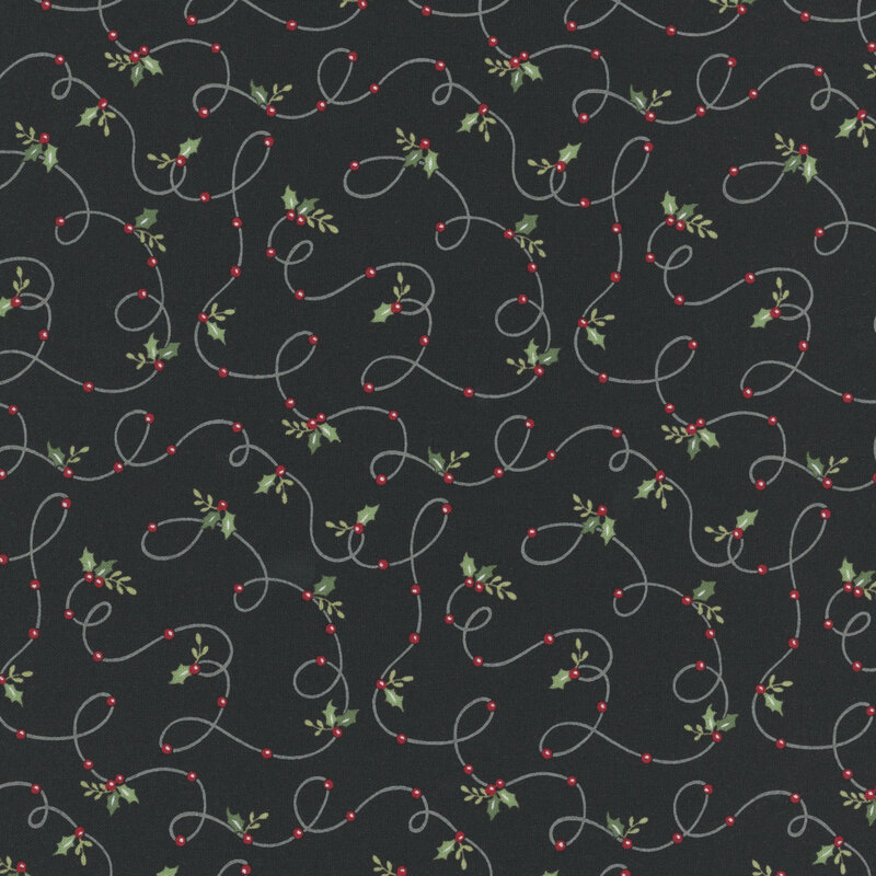 Charcoal black fabric with a winding design of holly and winter berries threaded onto a string.
