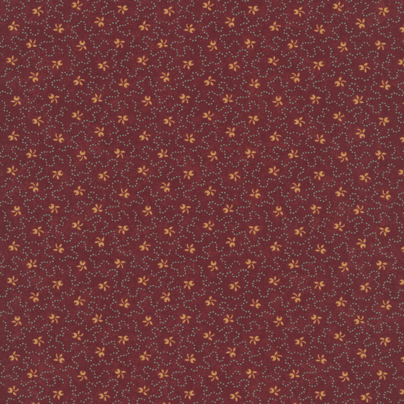 stylized ocher sprig motifs accented by wavy dotted lines on a burgundy background.