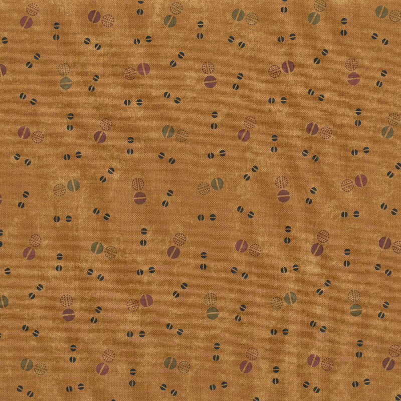dark gold mottled fabric features circular berry-like motifs in burgundy, green, and black