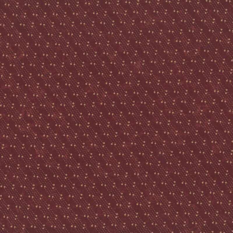 Mottled burgundy fabric featuring a stylized beaded-chain pattern in soft cream.