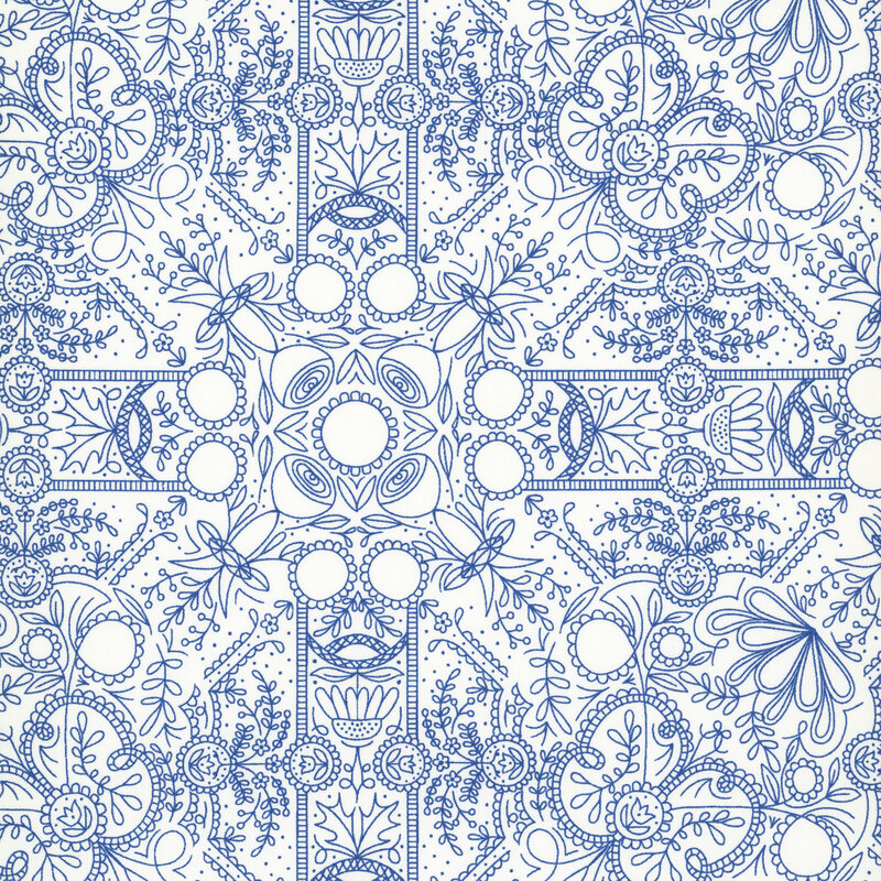 A white fabric with intricate blue linework forming symmetrical folk-art flowers, leafy vines, scrolls, and ornamental medallions.