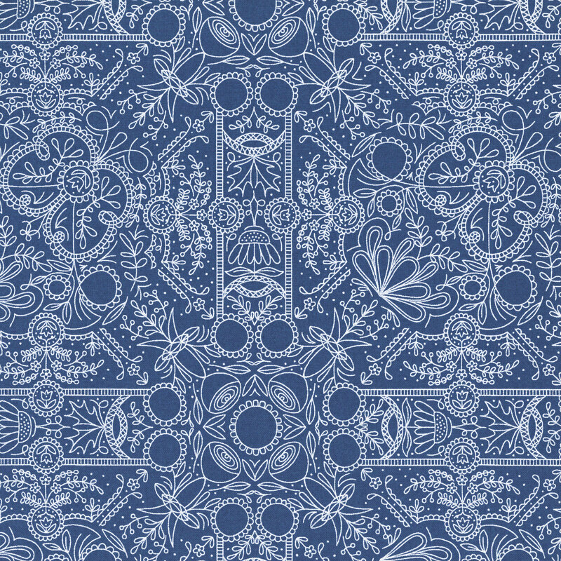 An indigo blue fabric with intricate blue linework forming symmetrical folk-art flowers, leafy vines, scrolls, and ornamental medallions.