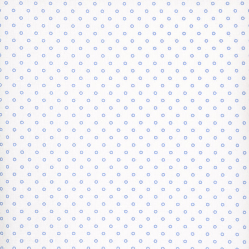 A white fabric with blue polka dots.